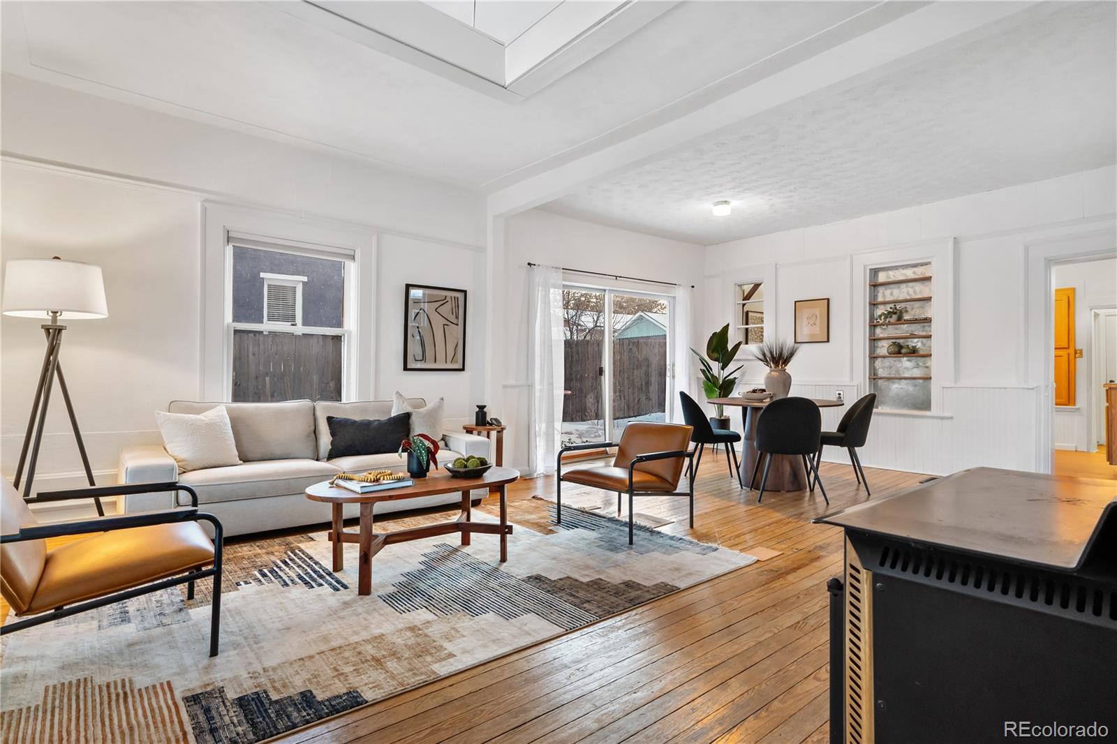 4743 Tejon Street Denver, CO 80211 - Photo 7 of 30 a living room with furniture and wooden floor