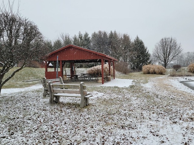 This picturesque outdoor setting includes a gazebo, perfect for relaxation and enjoying the natural surroundings.