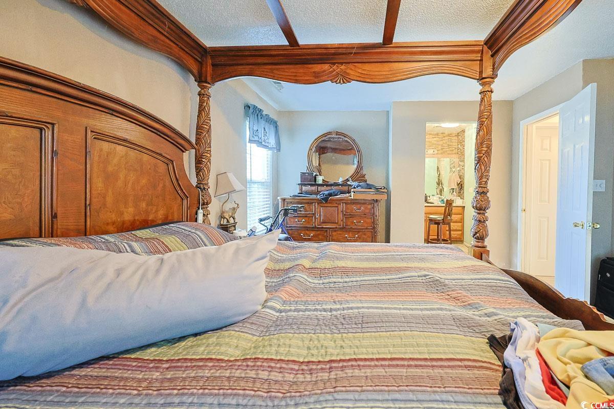 210 Rail Street Longs, SC 29568 - Photo 15 of 32 Bedroom with ensuite bathroom and a textured ceiling
