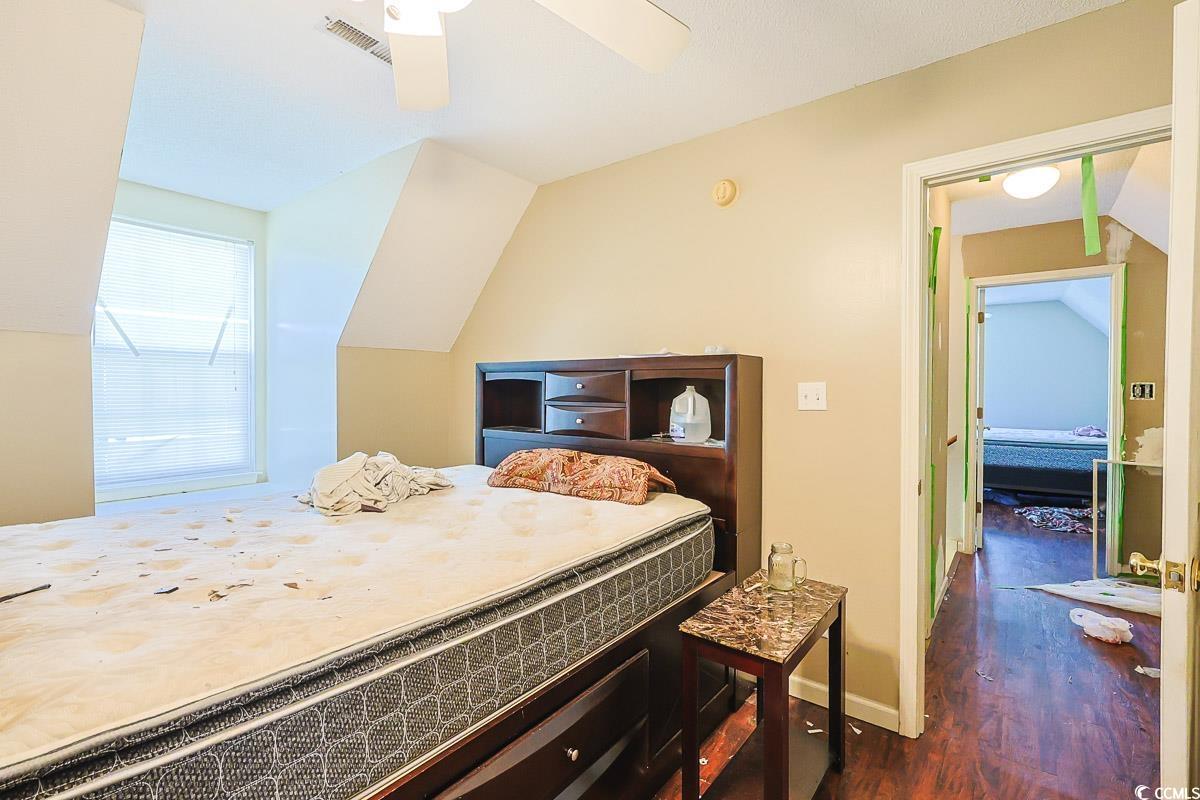 210 Rail Street Longs, SC 29568 - Photo 19 of 32 Bedroom featuring vaulted ceiling, dark wood-style flooring, and ceiling fan