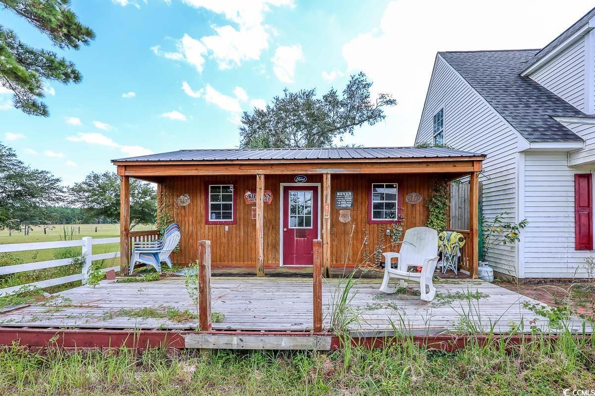 210 Rail Street Longs, SC 29568 - Photo 2 of 32 Rear view of house with board and batten siding