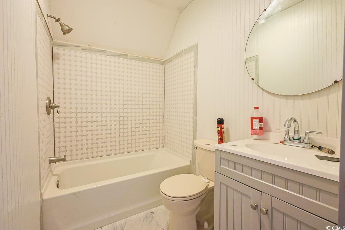 210 Rail Street Longs, SC 29568 - Photo 22 of 32 Bathroom with shower combination, vanity, and lofted ceiling