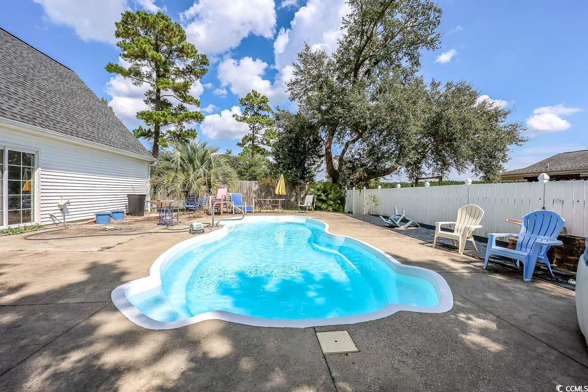 210 Rail Street Longs, SC 29568 - Photo 28 of 32 View of swimming pool featuring a patio area and a fenced backyard