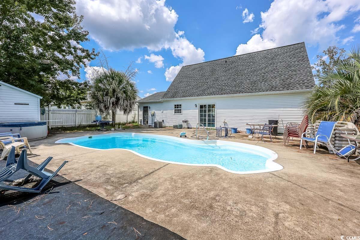 210 Rail Street Longs, SC 29568 - Photo 3 of 32 View of swimming pool with a patio