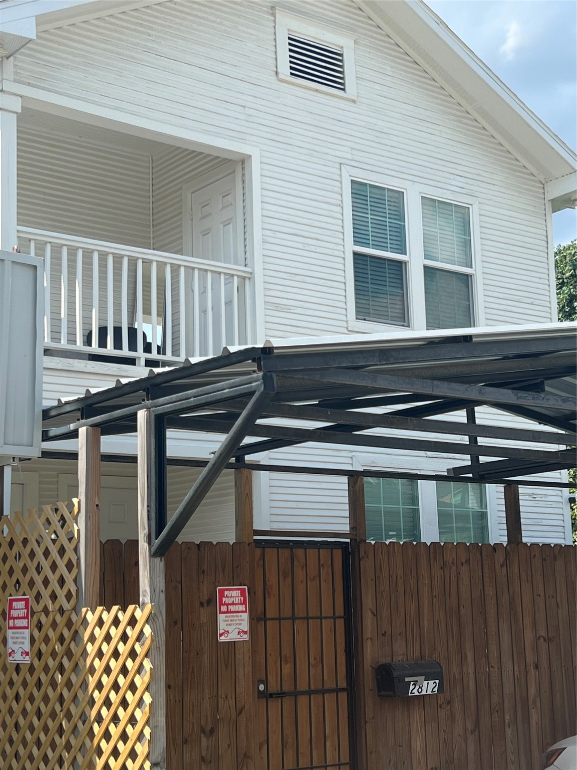 2812 Live Oak Street Houston, TX 77004 - Photo 1 of 6 a black and white building with wooden fence