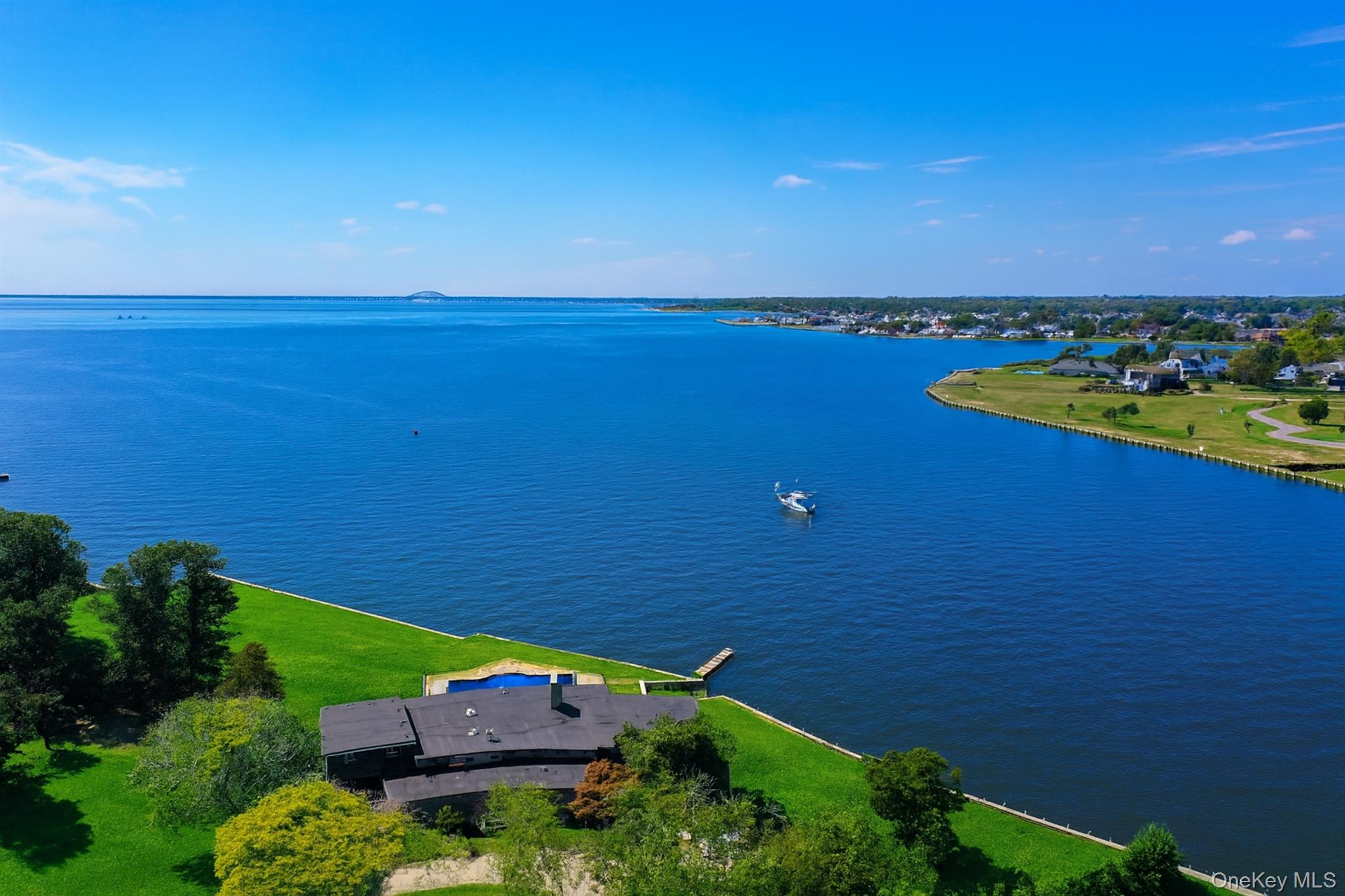 10 Great Cove Lane Islip, NY 11751 - Photo 1 of 31 an aerial view of a house with a lake view