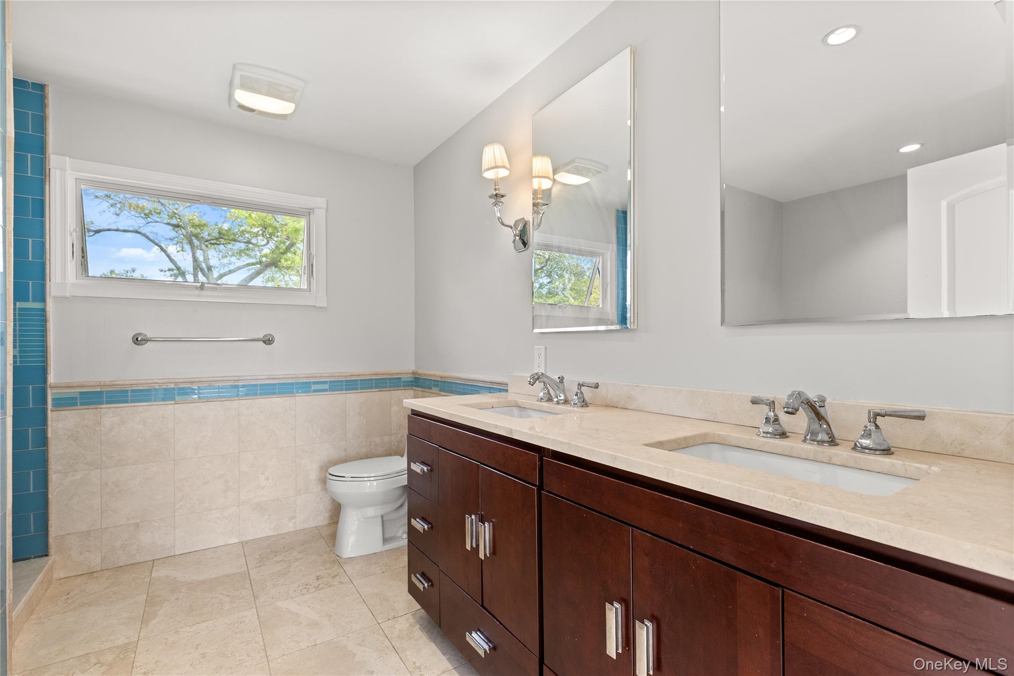 10 Great Cove Lane Islip, NY 11751 - Photo 19 of 31 a bathroom with a toilet a sink and mirror