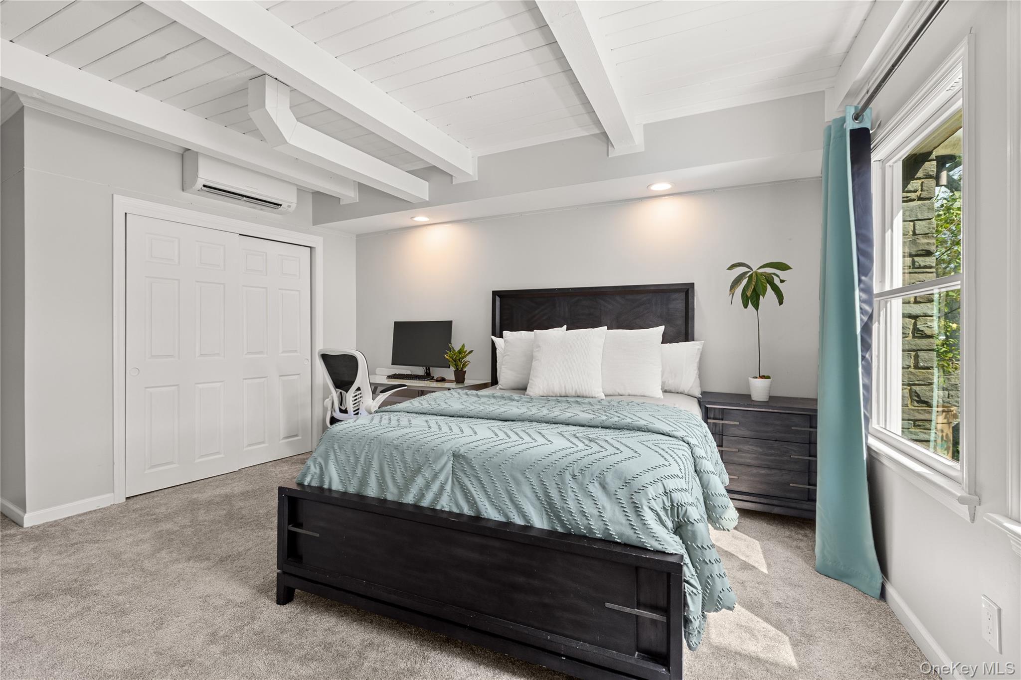 10 Great Cove Lane Islip, NY 11751 - Photo 24 of 31 a bedroom with a bed lamp and a large window