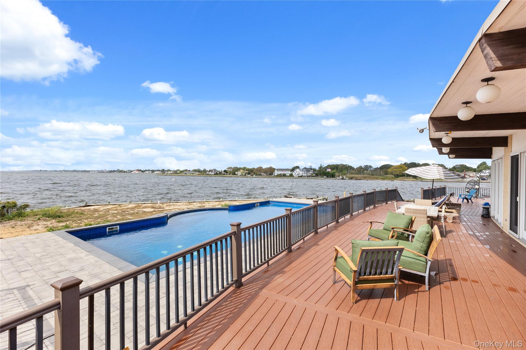 10 Great Cove Lane Islip, NY 11751 - Photo 27 of 31 a view of a balcony with wooden floor and city view