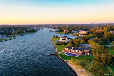 an aerial view of a house with big yard