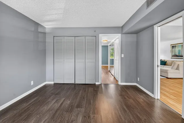 a view of hallway with wooden floor