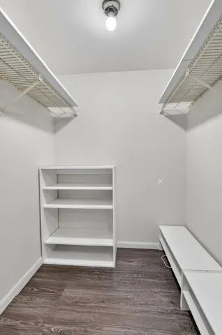 a view of an empty walk in closet