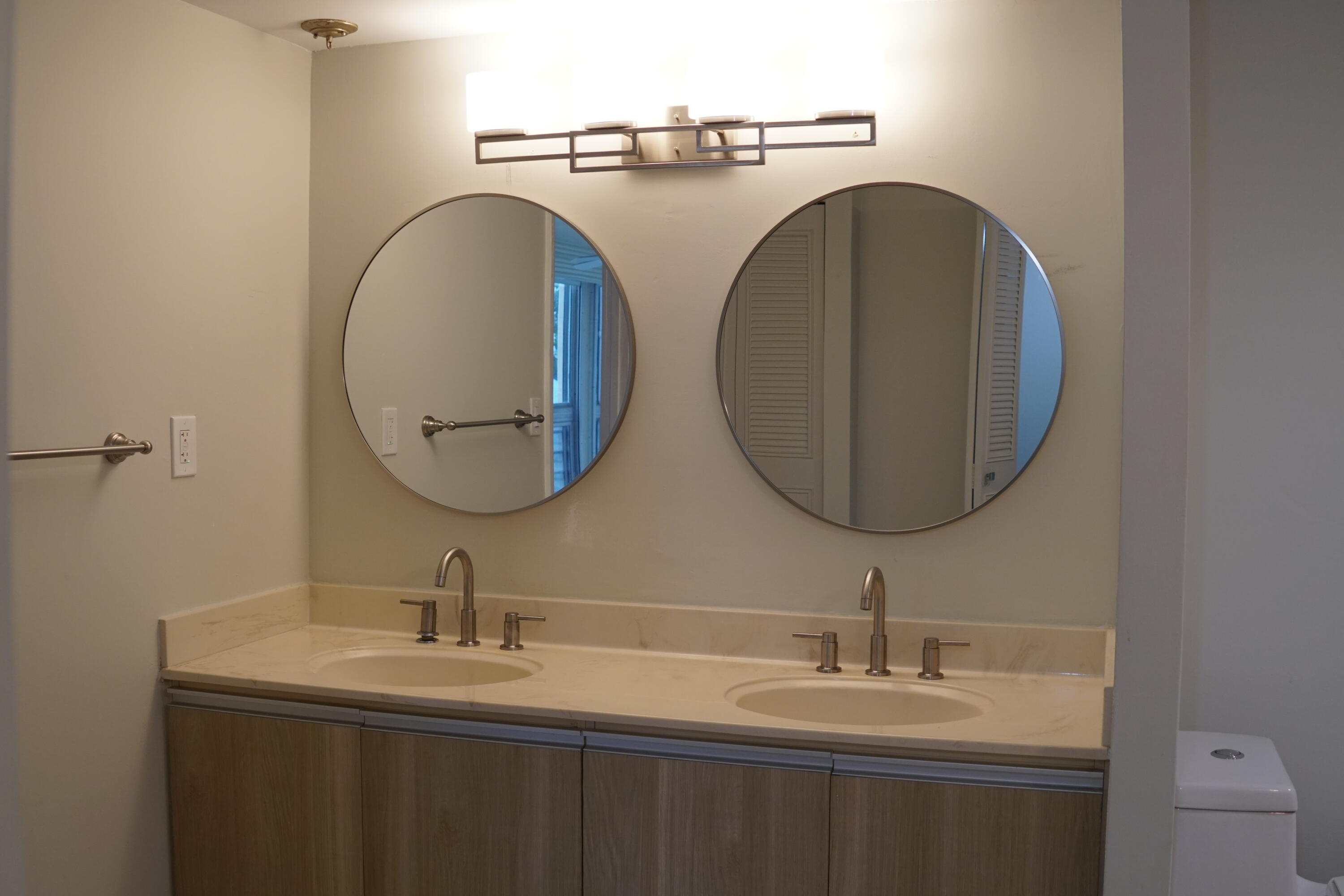 5340 Northwest 2nd Avenue, Unit 220 Boca Raton, FL 33487 - Photo 29 of 46 a bathroom with a sink and a mirror