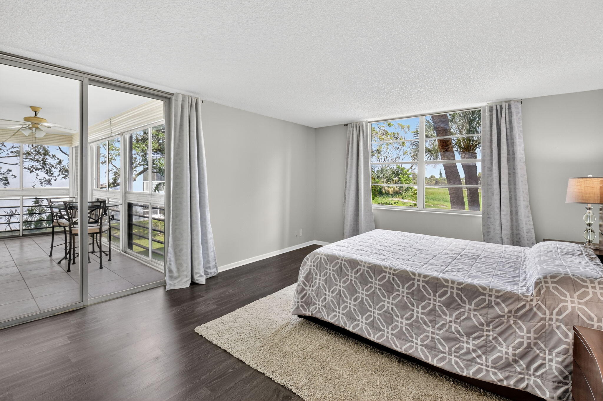 5340 Northwest 2nd Avenue, Unit 220 Boca Raton, FL 33487 - Photo 32 of 46 a bedroom with a large bed and a window