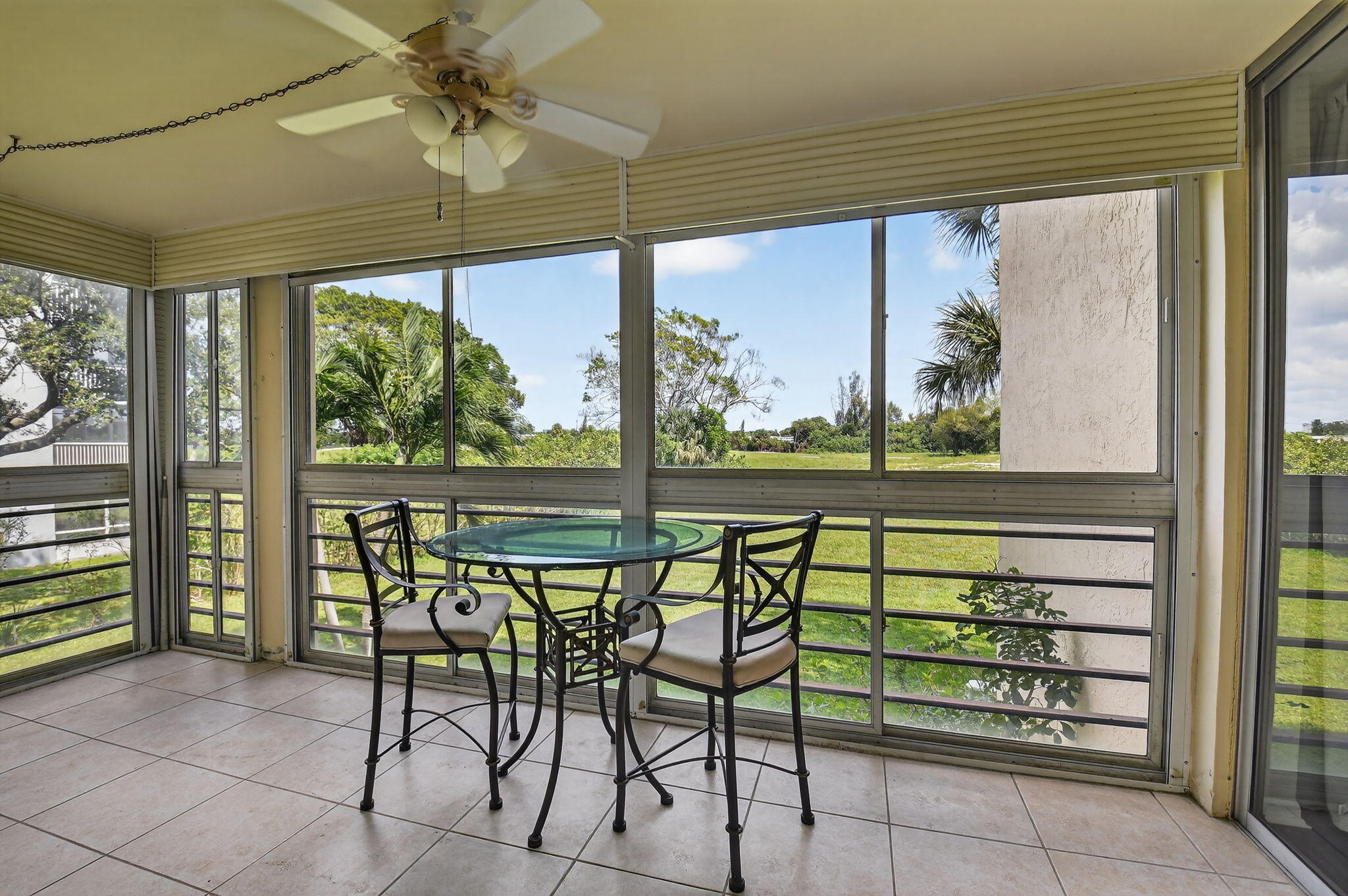 5340 Northwest 2nd Avenue, Unit 220 Boca Raton, FL 33487 - Photo 35 of 46 a view of a porch with chairs and backyard