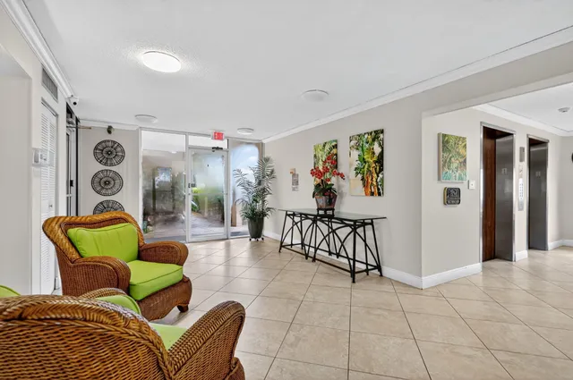 a living room with furniture and dining area