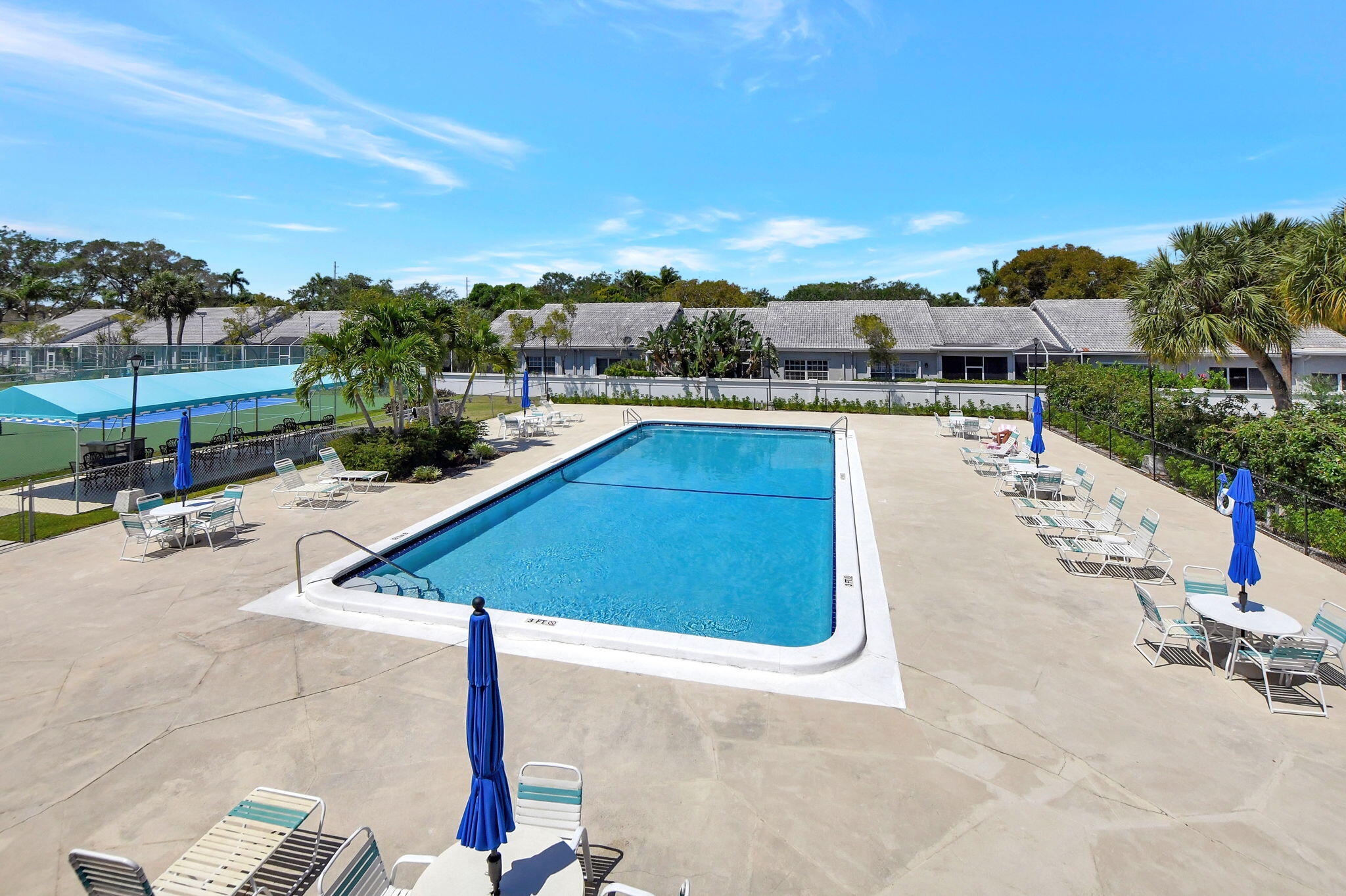 5340 Northwest 2nd Avenue, Unit 220 Boca Raton, FL 33487 - Photo 43 of 46 a swimming pool with outdoor seating and city view
