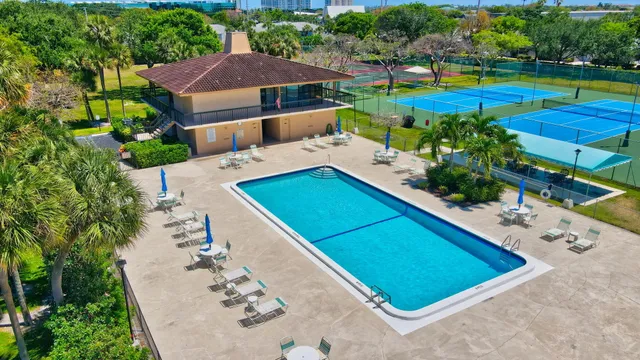 an aerial view of a pool yard patio and outdoor seating