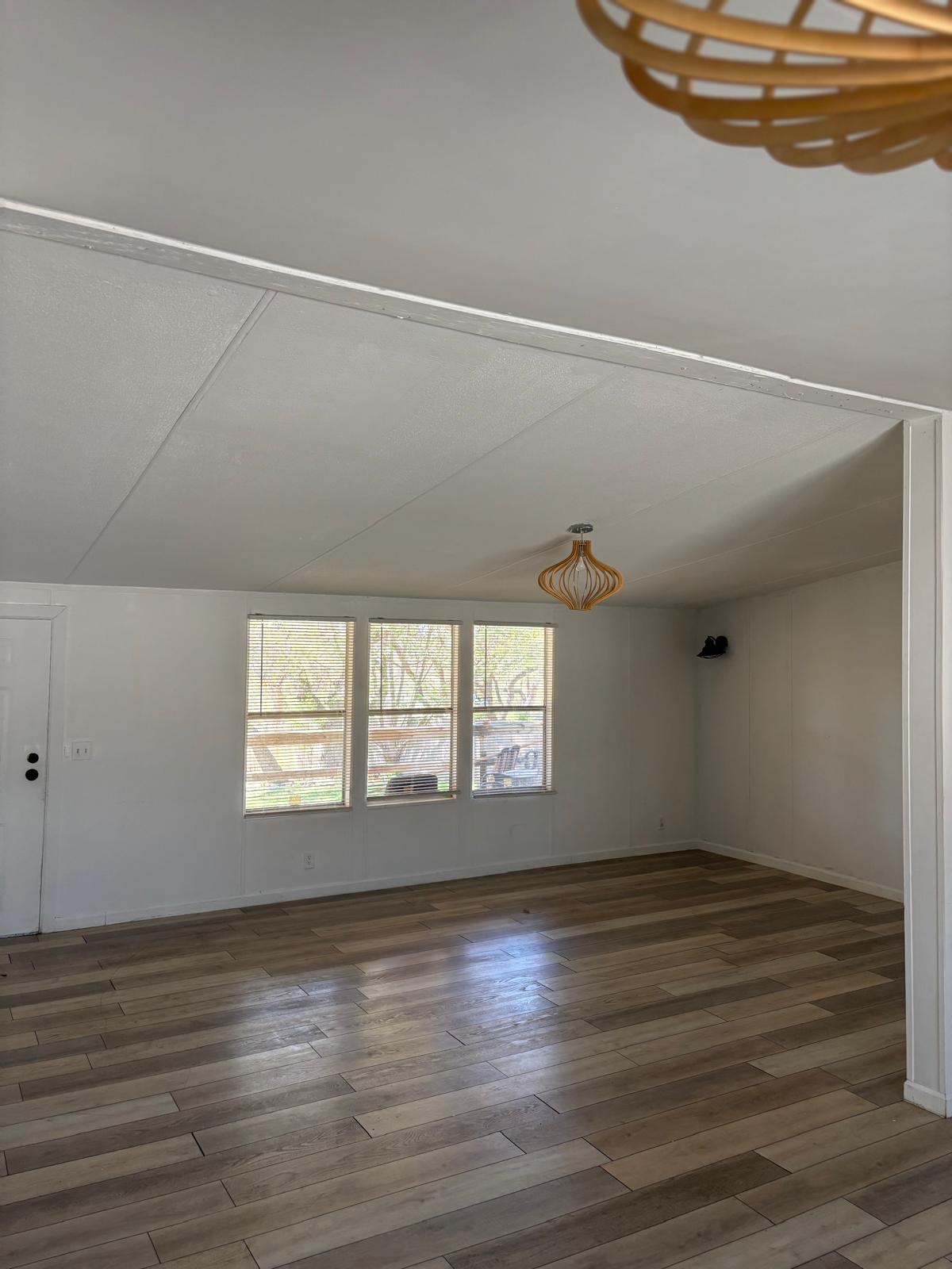 1109 Hurst Creek Road Austin, TX 78734 - Photo 14 of 18 Bonus room with dark wood finished floors and baseboards