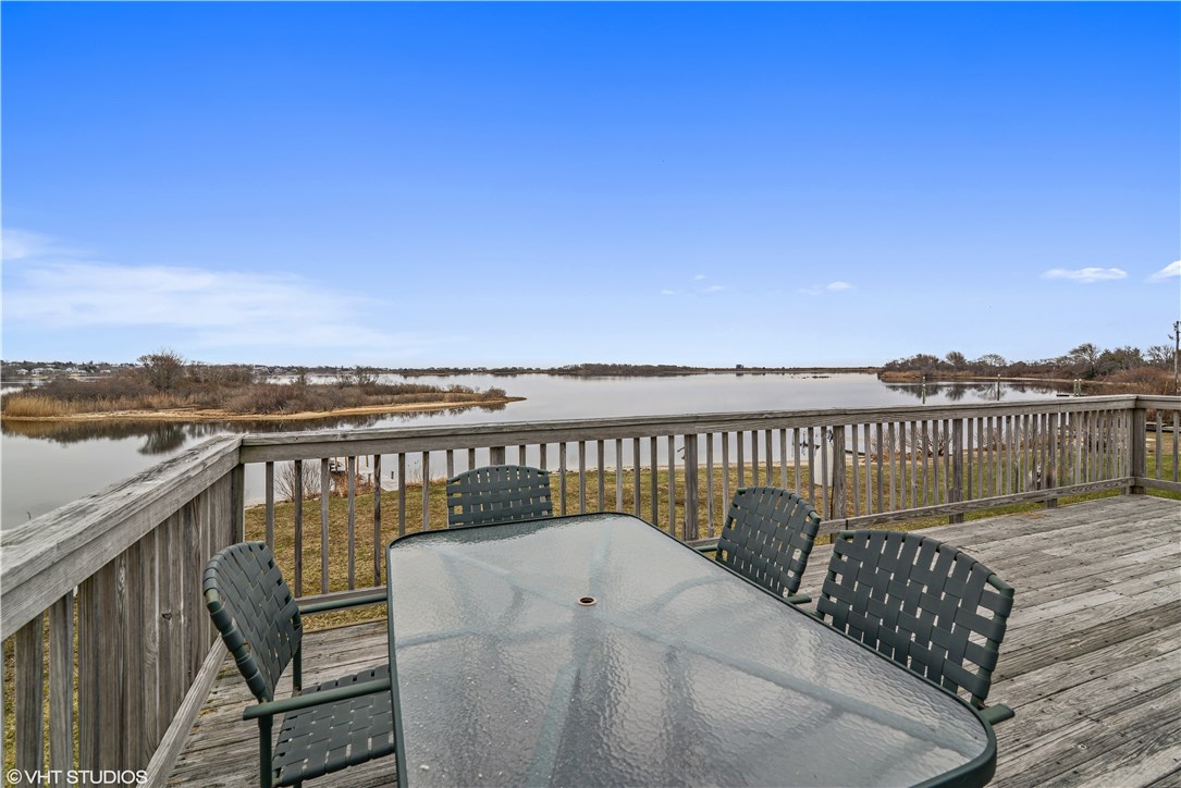 288 Ram Island Road Charlestown, RI 02813 - Photo 11 of 16 Enjoy dinner on the deck looking over Green Hill Pond to the ocean