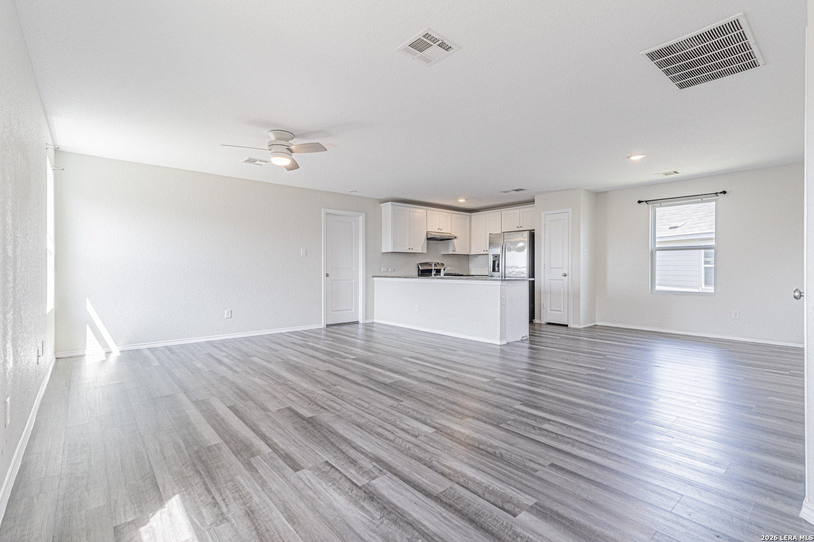 3814 Pickles Way Converse, TX 78109 - Photo 2 of 27 a view of a kitchen with wooden floor and a sink