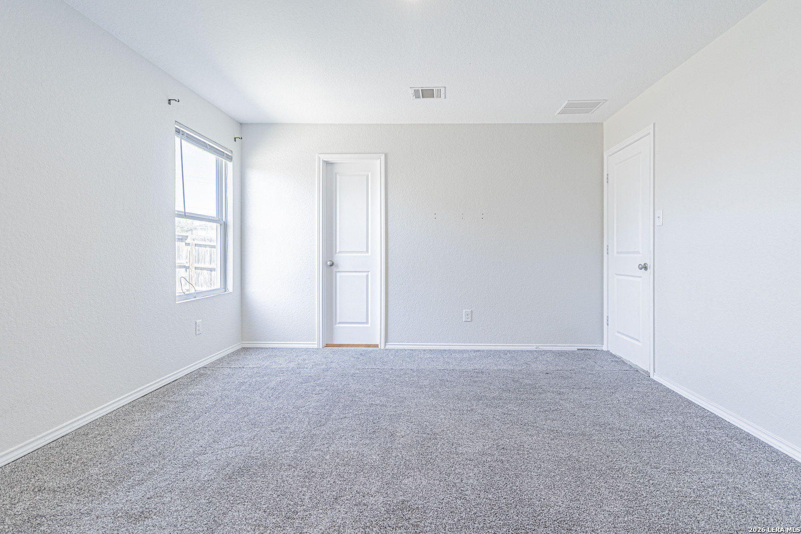 3814 Pickles Way Converse, TX 78109 - Photo 23 of 27 a view of an empty room with windows