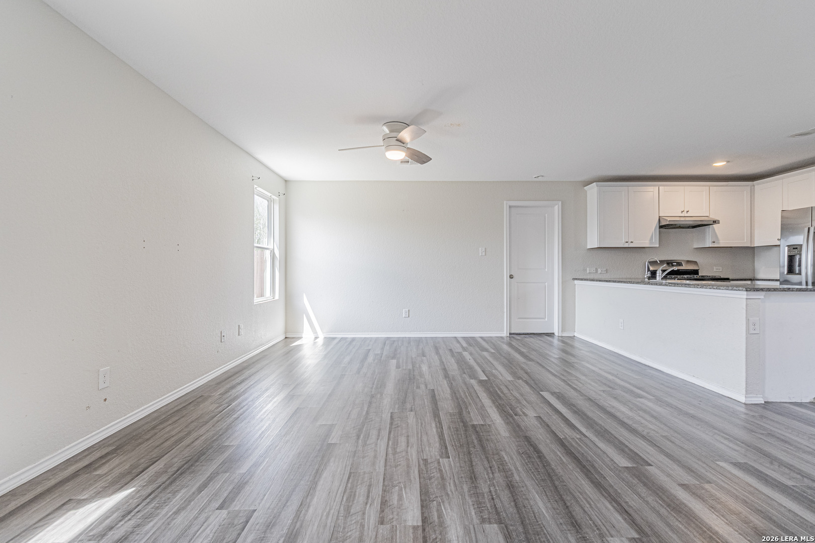 3814 Pickles Way Converse, TX 78109 - Photo 3 of 27 a view of a kitchen with wooden floor and a sink