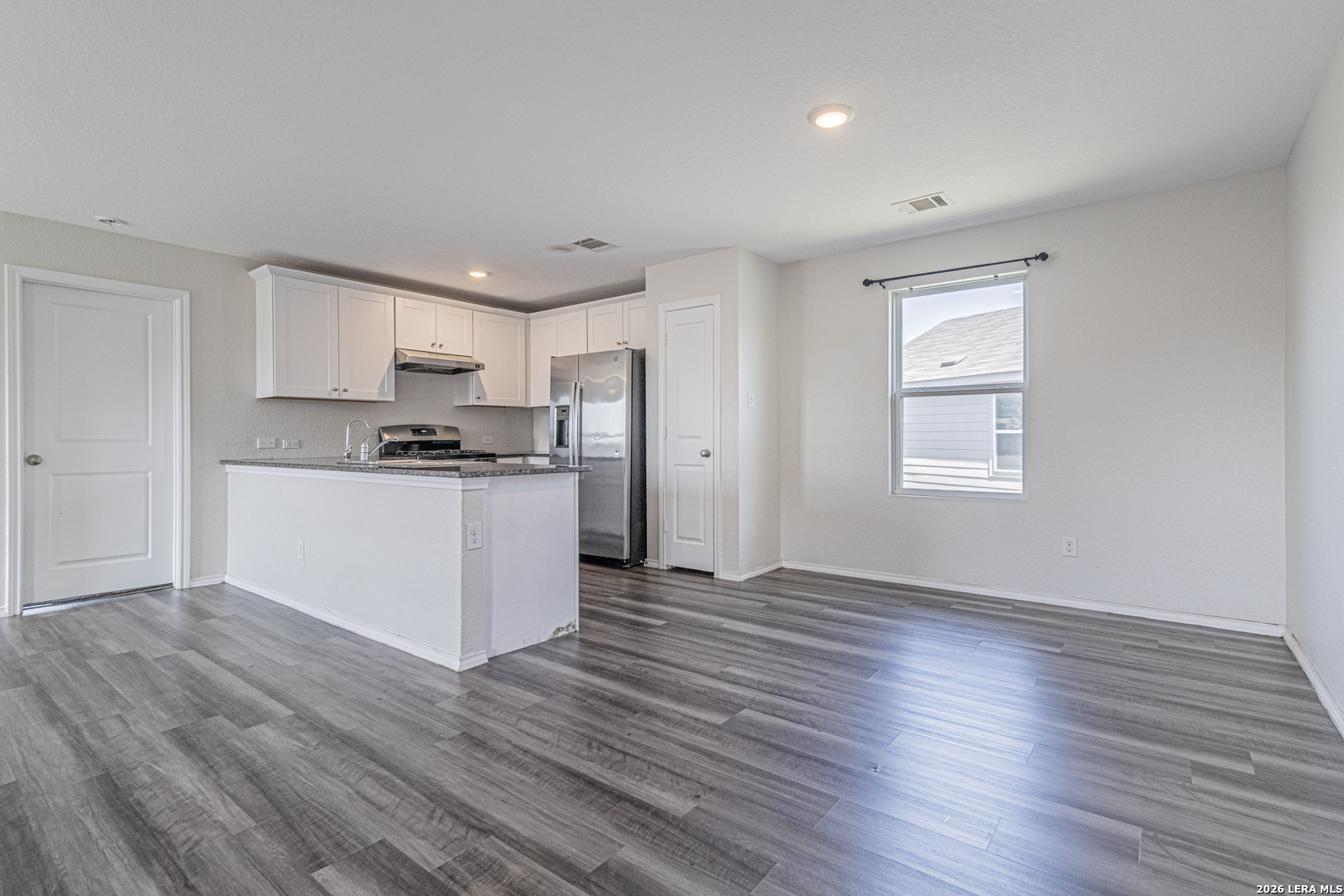 3814 Pickles Way Converse, TX 78109 - Photo 8 of 27 a view of kitchen with wooden floor and electronic appliances
