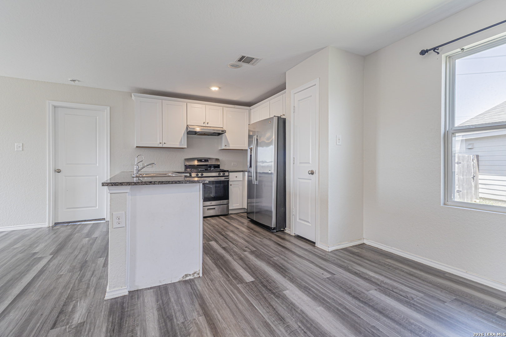 3814 Pickles Way Converse, TX 78109 - Photo 10 of 27 a kitchen with stainless steel appliances a refrigerator sink and cabinets