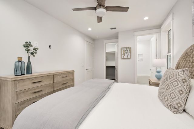 a bedroom with a large bed and closet