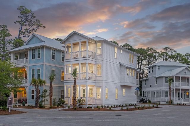 a front view of a residential apartment building with a yard