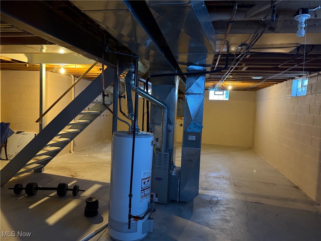 1201 Mulberry Run Mineral Ridge, OH 44440 - Photo 18 of 21 Basement with heating unit and water heater