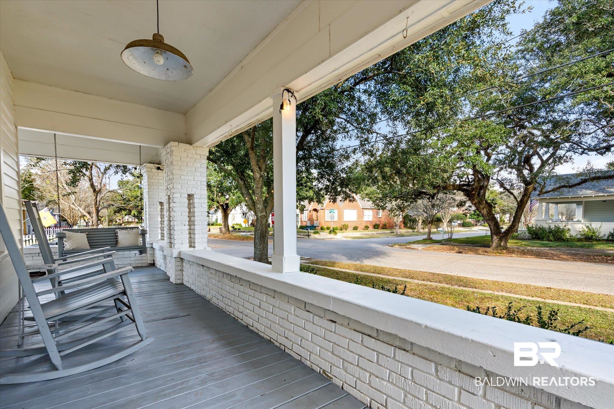 180 Williams Street Mobile, AL 36606 - Photo 2 of 20 Wooden terrace with covered porch