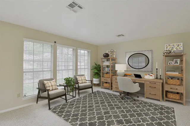 a living room with furniture fireplace and a flat screen tv