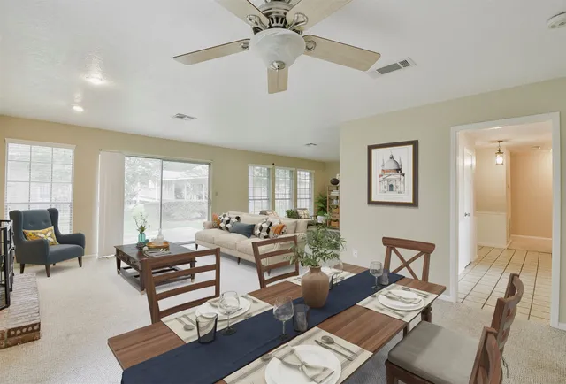 a kitchen with a refrigerator a sink and cabinets