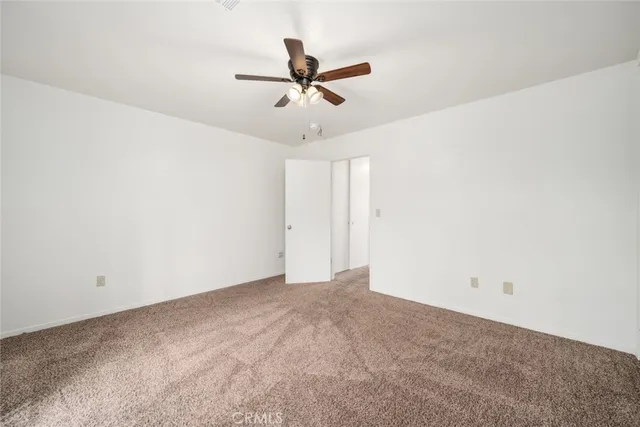 a view of a ceiling fan in a room