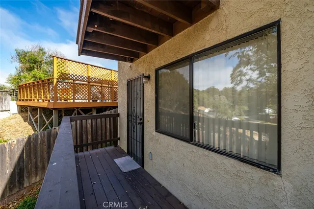 a view of hallway with wooden floor