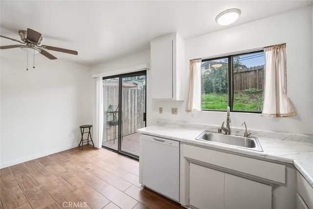 a kitchen with a sink and large window