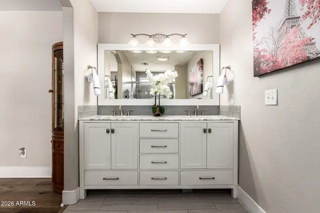 a bathroom with a sink and a mirror