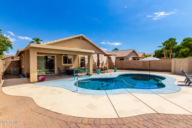 a view of a house with swimming pool