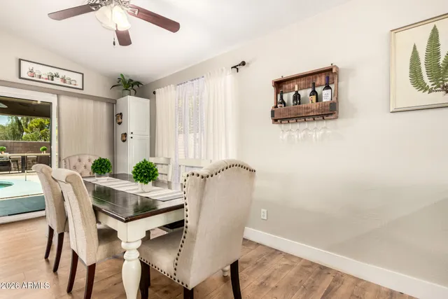 a dining room with furniture and window
