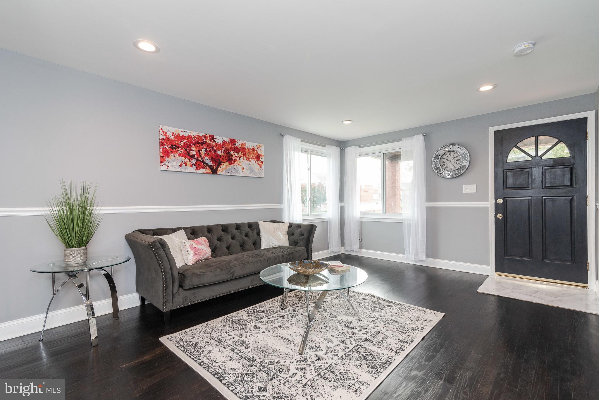 700 Aldworth Road Baltimore, MD 21222 - Photo 1 of 30 a living room with furniture and wooden floor