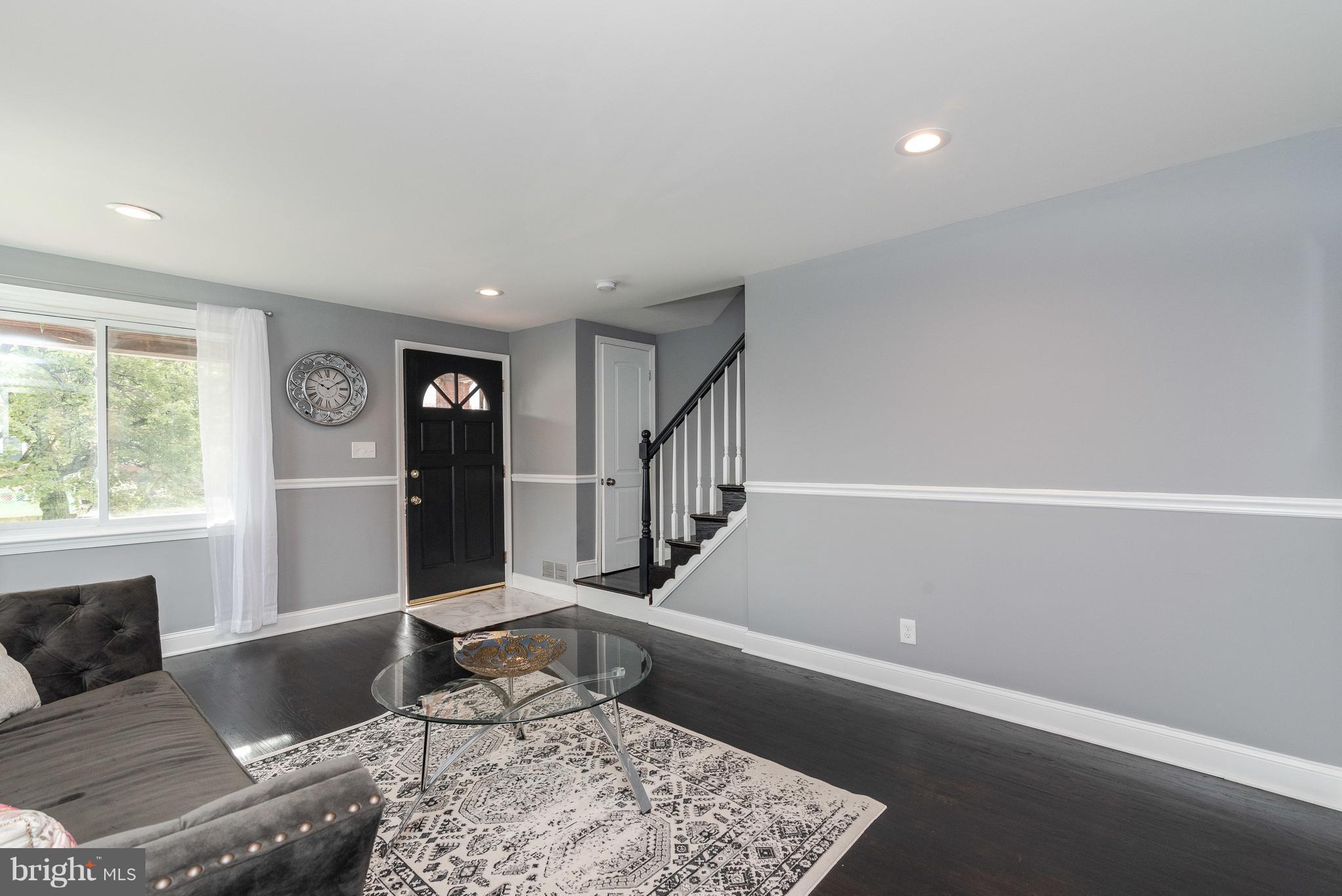 700 Aldworth Road Baltimore, MD 21222 - Photo 2 of 30 a living room with furniture and a rug