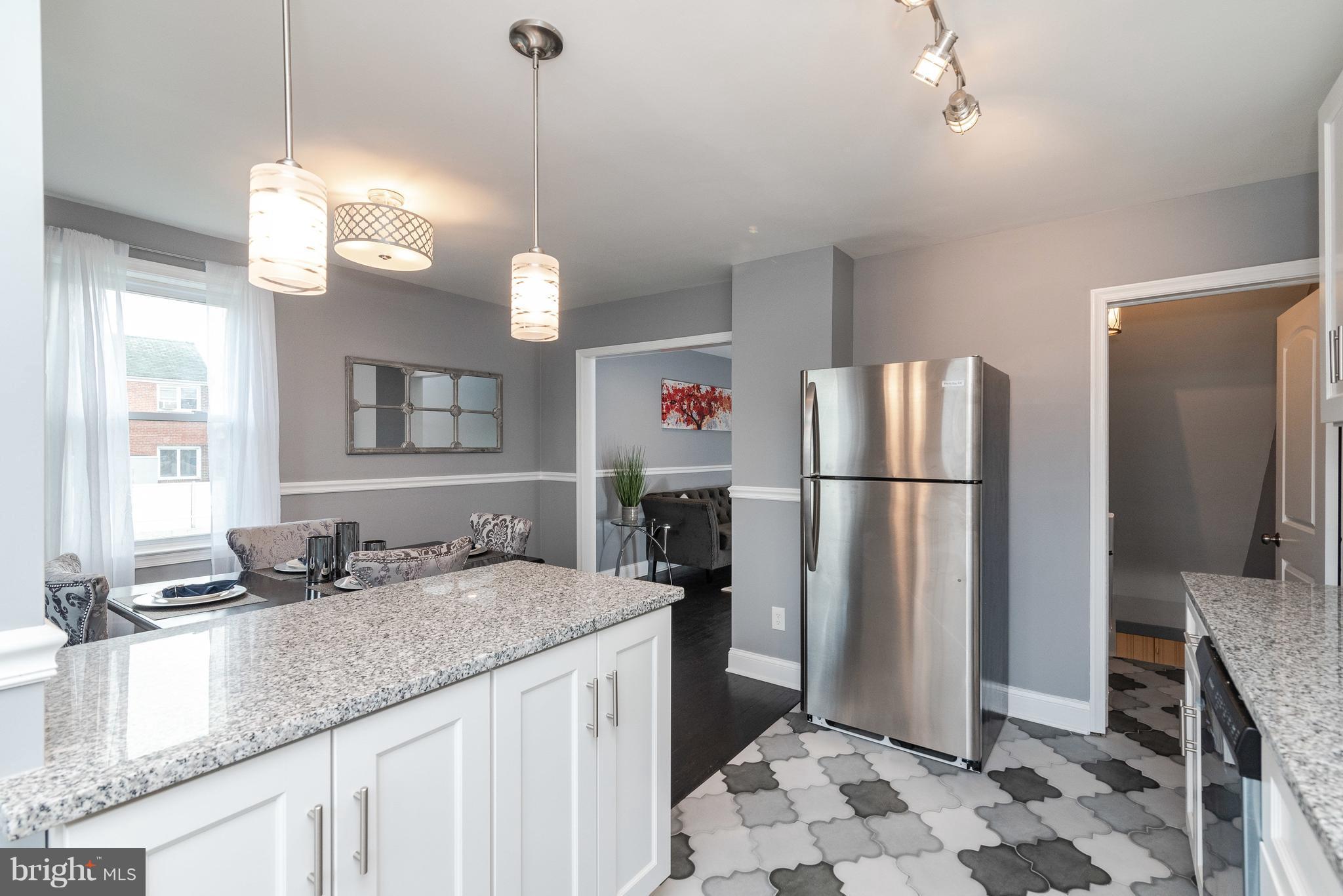 700 Aldworth Road Baltimore, MD 21222 - Photo 11 of 30 a kitchen with stainless steel appliances granite countertop a sink refrigerator and microwave