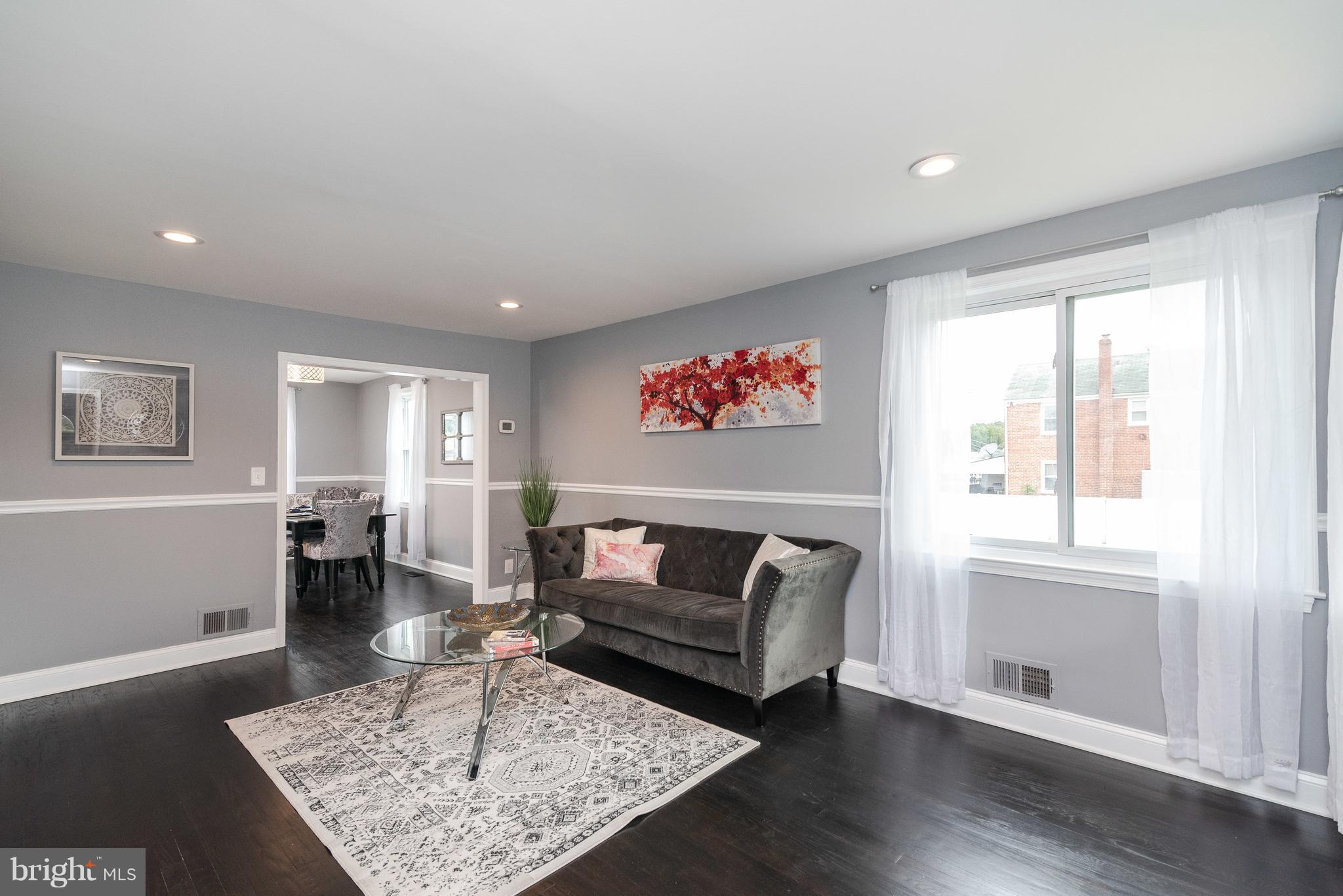 700 Aldworth Road Baltimore, MD 21222 - Photo 3 of 30 a living room with furniture rug and window