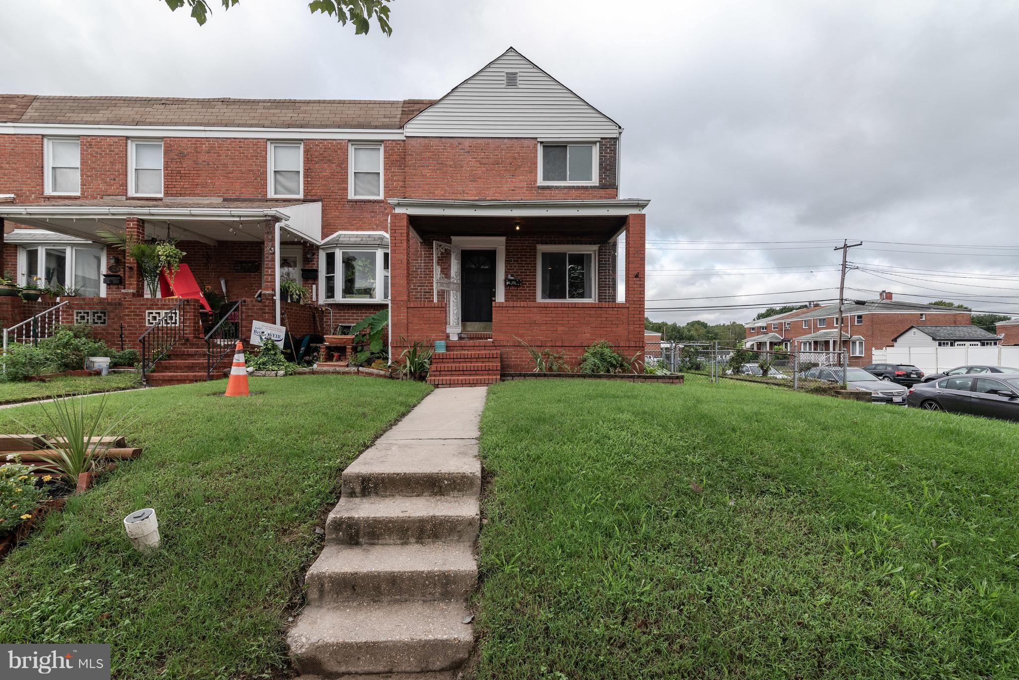 700 Aldworth Road Baltimore, MD 21222 - Photo 26 of 30 a front view of a house with a yard