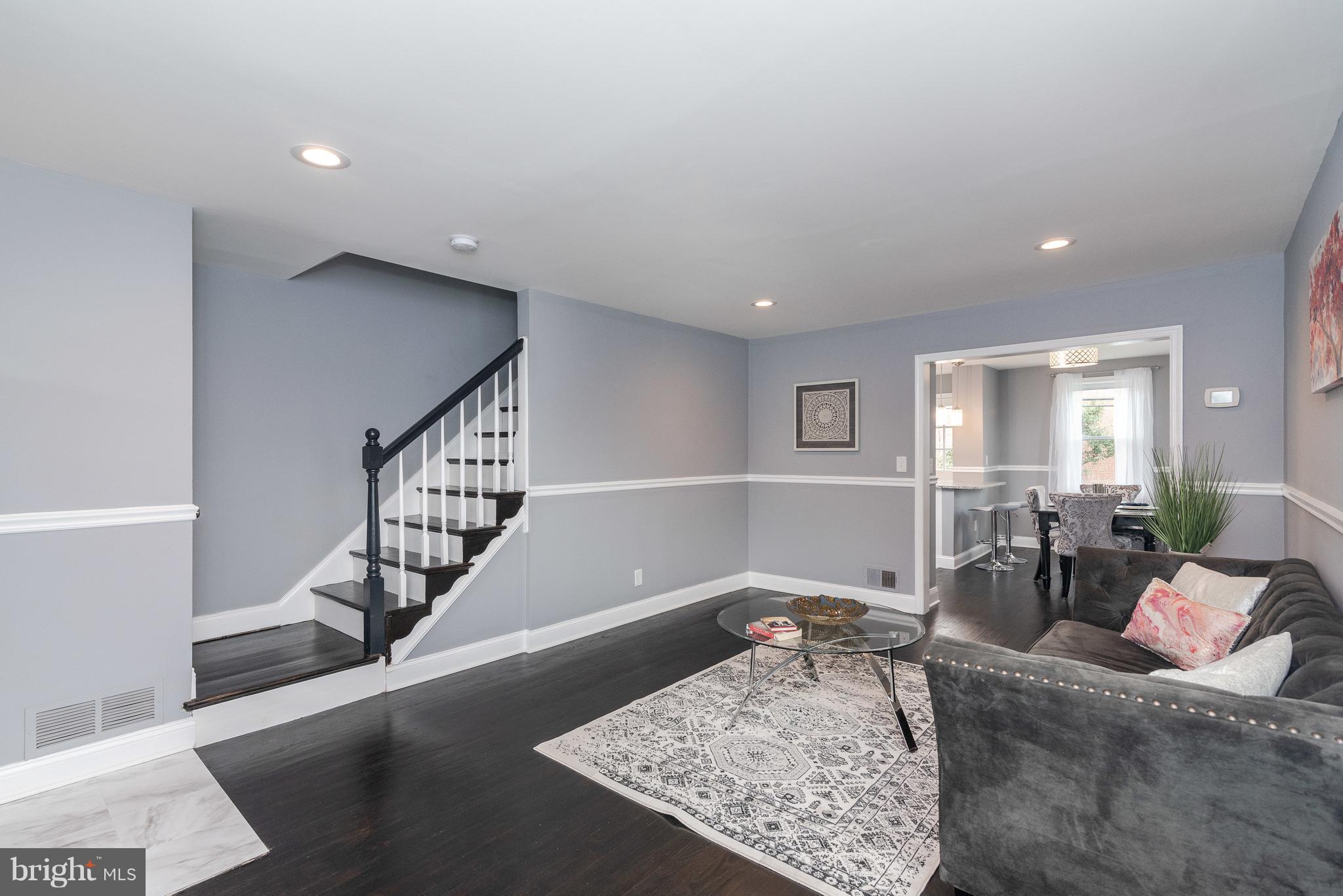 700 Aldworth Road Baltimore, MD 21222 - Photo 4 of 30 a living room with furniture and wooden floor