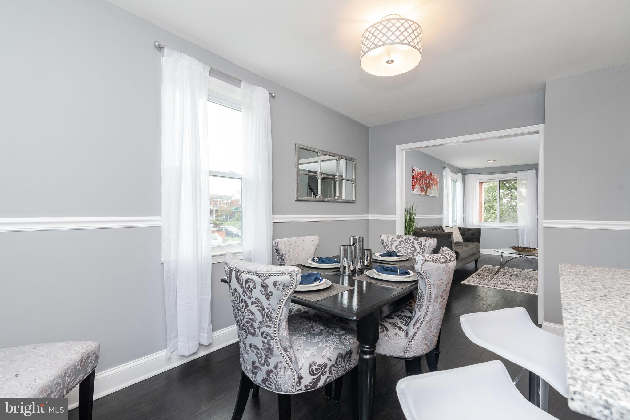 700 Aldworth Road Baltimore, MD 21222 - Photo 5 of 30 a view of a dining room with furniture window and wooden floor