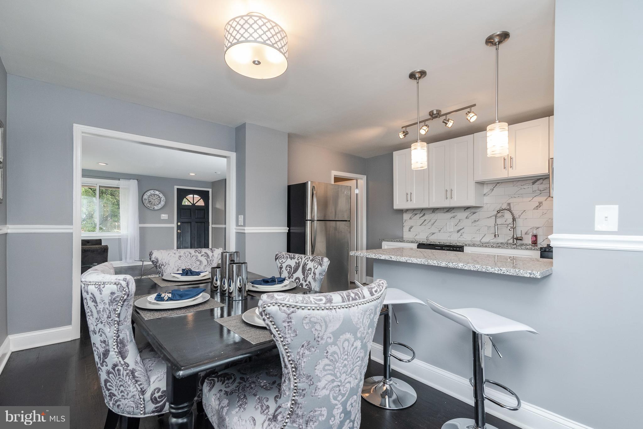 700 Aldworth Road Baltimore, MD 21222 - Photo 6 of 30 a view of a dining room with furniture