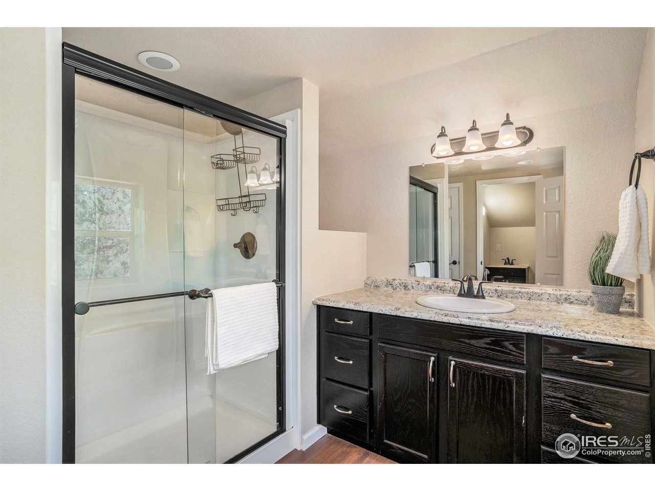 372 Cherokee Road Lyons, CO 80540 - Photo 15 of 33 a bathroom with a double vanity sink and mirror